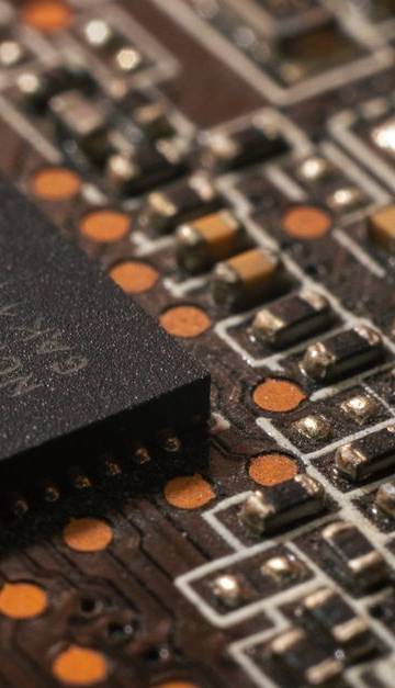 Detailed close-up of a computer circuit board showcasing electronic components.